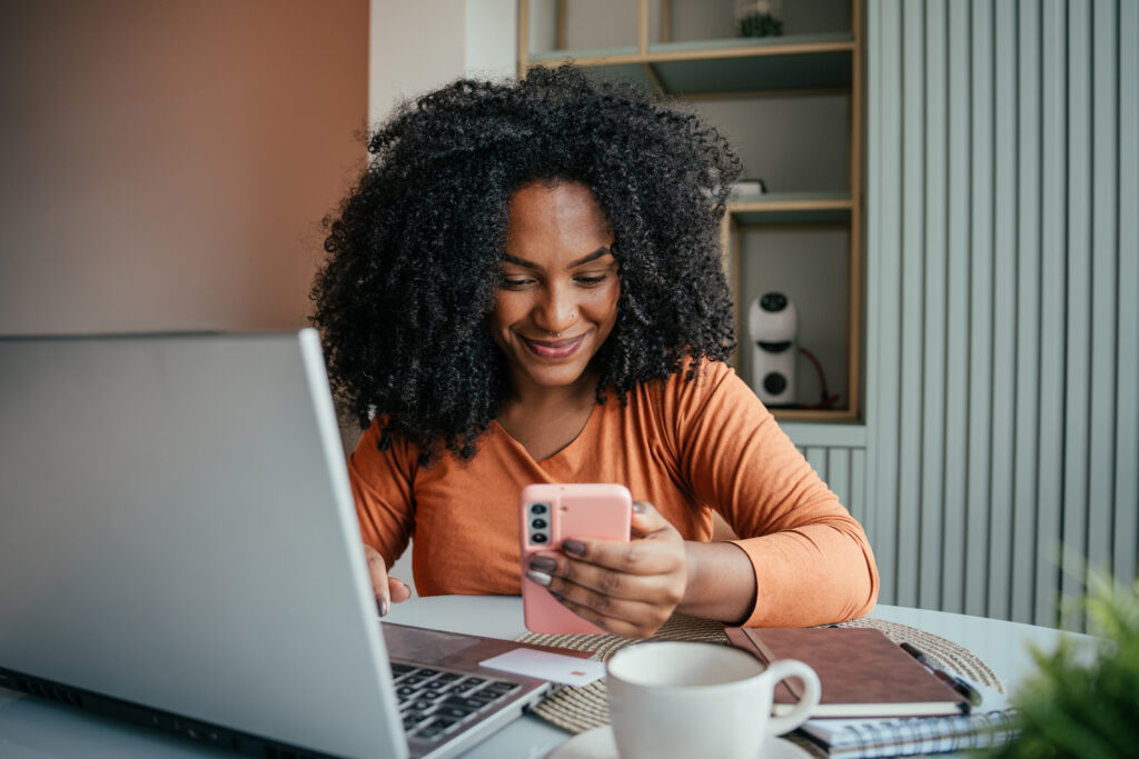 Young woman shopping online, credit card, spending money, consumerism